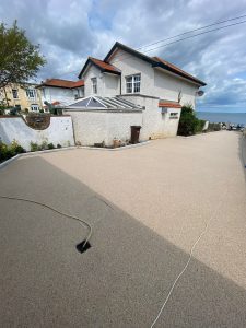 Large front garden with resin driveway paving by kilcroney paving contractors
